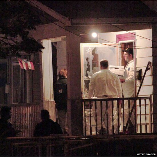 FBI agents at the house in Cleveland where Amanda Berry, Gina DeJesus and Michelle Knight were found, 7 May 2013