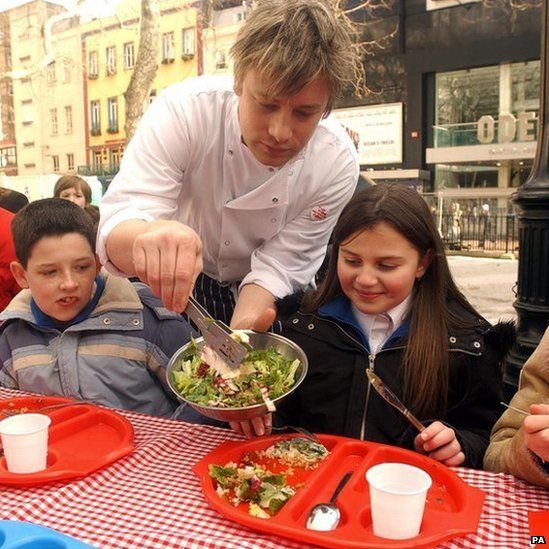 Jamie Oliver serves school dinners