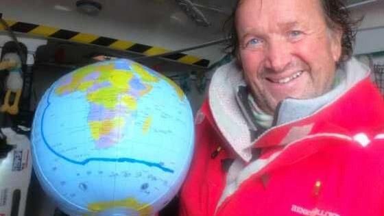 Dafydd Hughes with a globe showing his route so far
