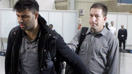 David Miranda (left) and his partner Glenn Greenwald at Rio airport