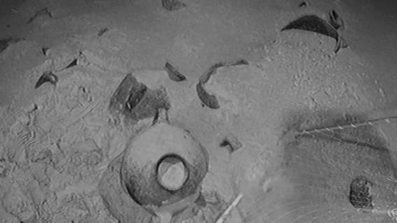 Images show the storage jars sunk into the sea bed