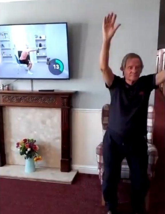 A still from a video of resident John enjoys being put through his paces at Longmoor Lodge Care Home in Sandiacre. He's been joining in with Joe Wicks' morning exercise routine and is feeling as fit as a fiddle.