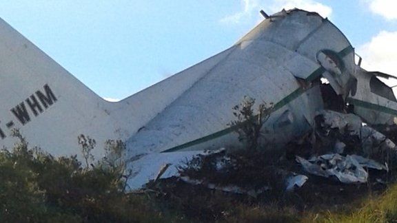 An Algerian military transport plane is pictured after it slammed into a mountain in the country's rugged eastern region, on Tuesday