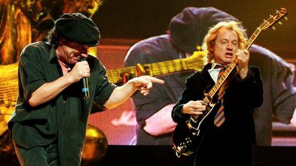 AC/DC's frontman Brian Johnson, left, and guitarist Angus Young perform at New York's Madison Square Garden in 2001