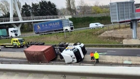 A lorry on its side on the A14 by Bar Hill, Cambridgeshire