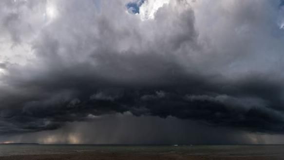 A dark storm cloud over the south coast of England 