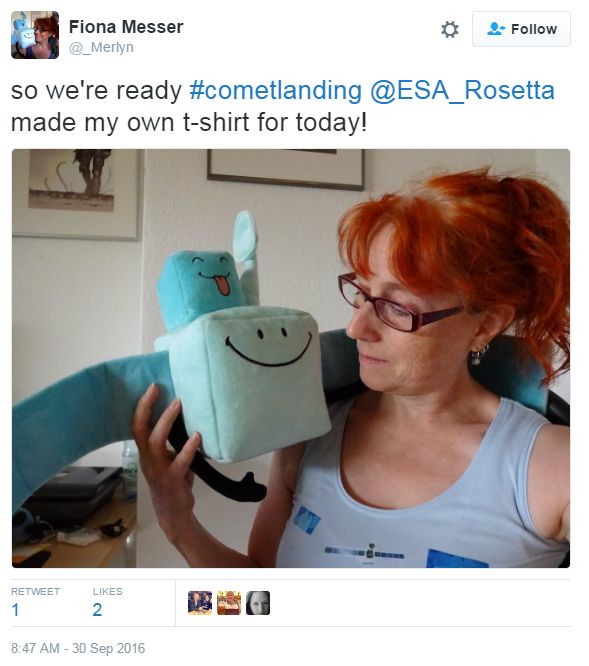Woman holding a Rosetta soft toy, saying she made her t-shirt with pictures of the probe as well