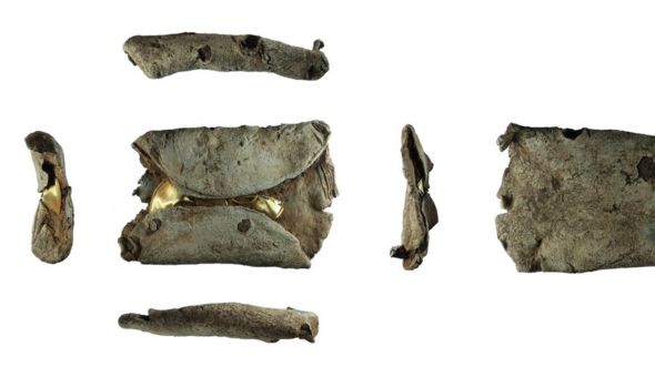 Two late Bronze Age gold lock rings within a lead ingot which has been reused as a sinker