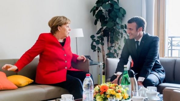 French President Emmanuel Macron and German Chancellor Angela Merkel meet on the sidelines of an EU summit in Brussels