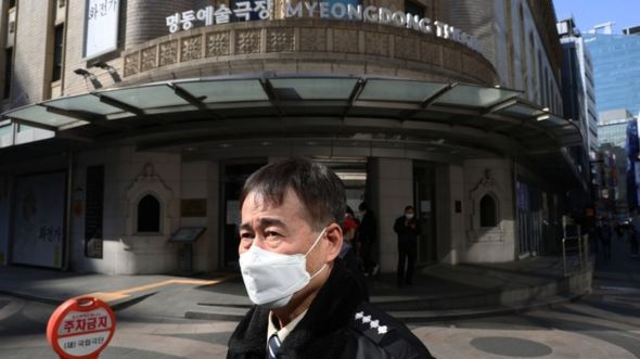 A South Korean woman wears a mask to protect herself from the coronavirus in Seoul