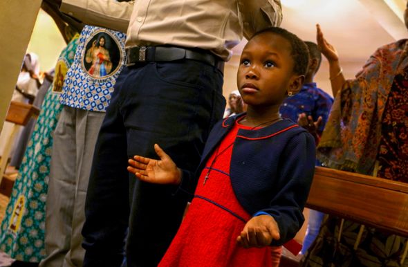 Girl praying in church