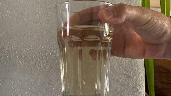 A glass of discoloured water