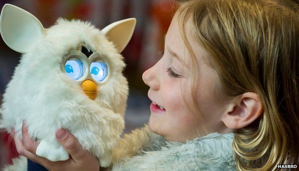 Furby held by a child