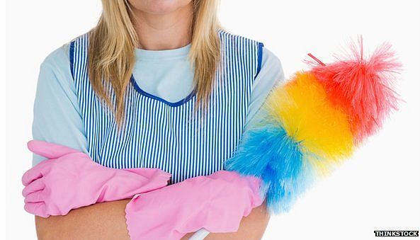 Woman holding a feather duster