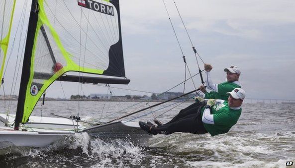 Danish sailors Allan Norregaard (right) and Anders Thomsen warm up before an international sailing competition on the waters of Guanabara Bay