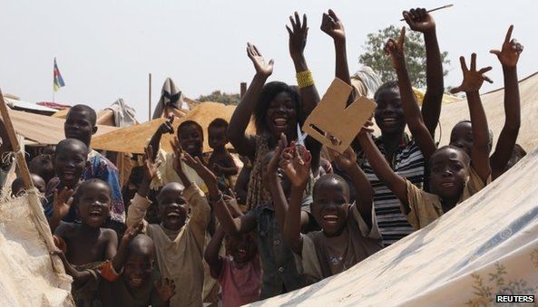 Children celebrate the resignation of interim President Michel Djotodia at Bangui airport camp