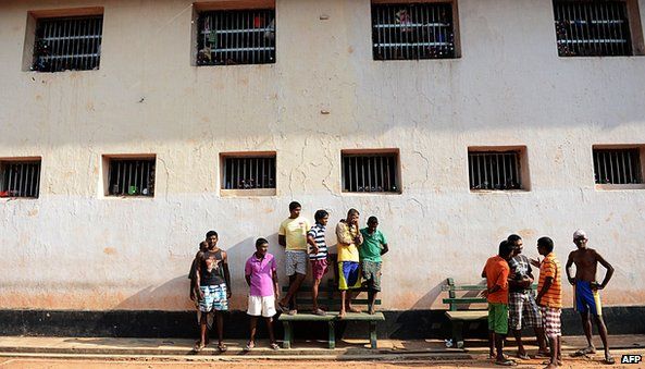 Sri Lankan prisoners look on during an event to celebrate Sinhalese and Tamil New Year at a prison complex in Colombo on April 24, 2013