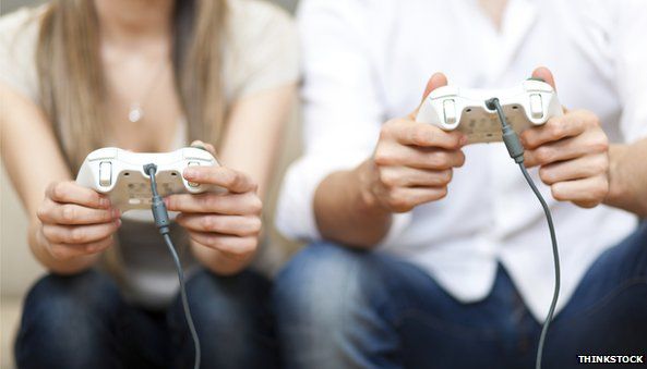 Woman and man playing videogames