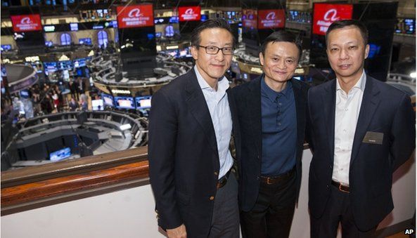 In this photo provided by the New York Stock Exchange, Alibaba founder Jack Ma, center, poses for a photograph before ringing the opening bell to celebrate his company"s initial public offering, Friday, Sept. 19, 2014, in New York