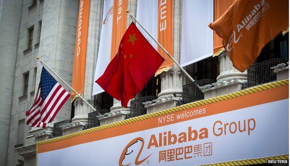 US, Chinese and Alibaba flags outside NYSE