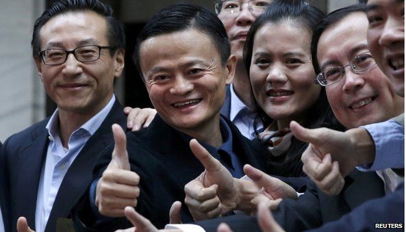 Alibaba Group Holding Ltd founder Jack Ma (2nd L) poses as he arrives at the New York Stock Exchange for his company"s initial public offering (IPO) under the ticker "BABA" in New York September 19, 2014.