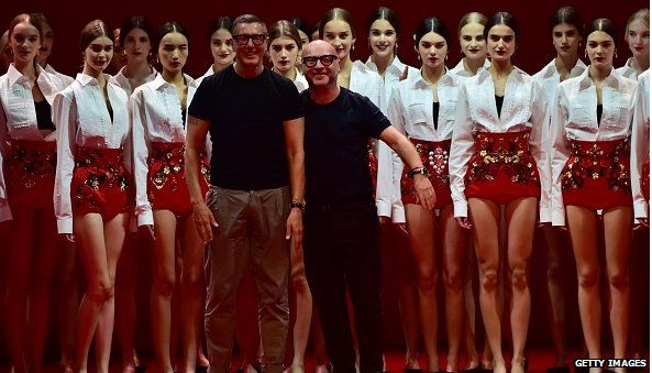 Stefano Gabbana and Domenico Dolce in front of models