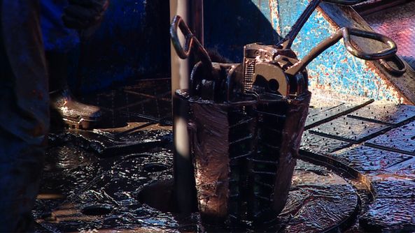 Tool covered in oil from rig in Oklahoma