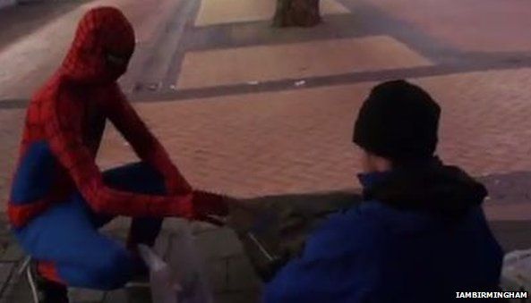 Spiderman gives out food