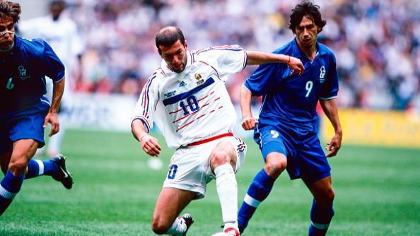 Zinedine Zidane of France and Demetrio Albertini and Fabio Cannavaro of Italy in action during the World Cup quarter final match between France and Italy, 1998.