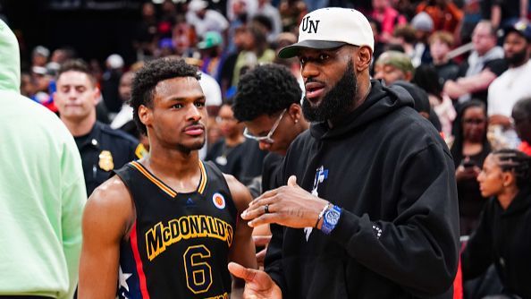 Bronny James of the West team talks to father Lebron James after the 2023 McDonald's High School Boys All-American Game, 2023.