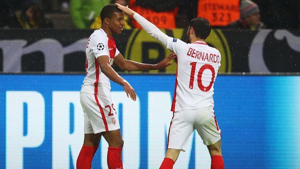 Bernardo Silva touches Monaco team-mate Kylian Mbappe's head in celebration