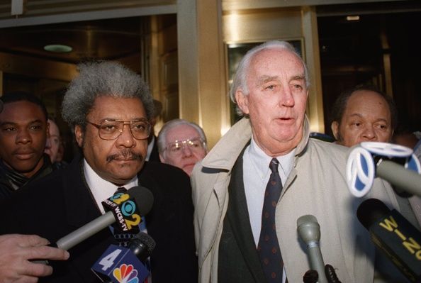 Don King and his lawyer Peter Fleming face the press outside court in 1995.