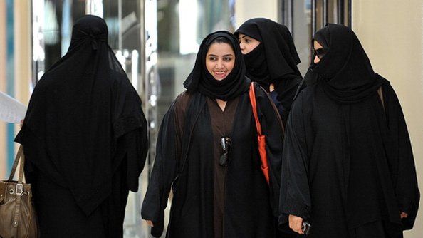 Saudi women walk inside the 'Faysalia' mall in Riyadh City, on September 26, 2011,