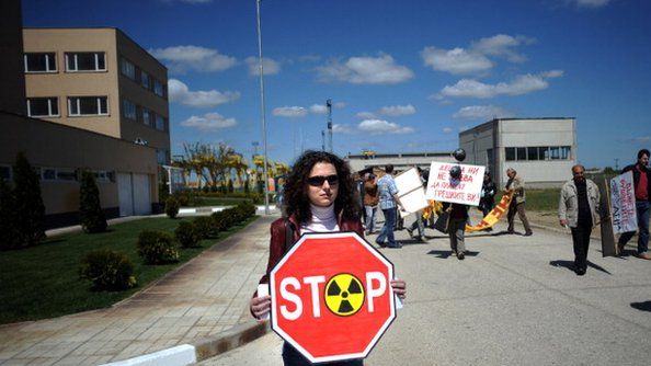 A woman carries an anti-nuclear sign at the construction site for Bulgaria's second nuclear plant near Belene, in April 2011