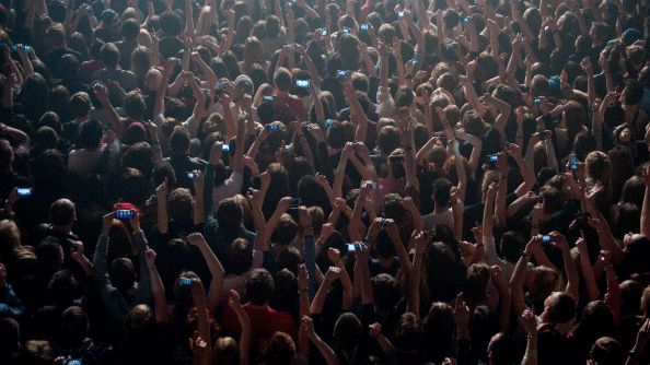 Crowd of people with mobiles