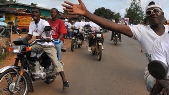 People on motorbikes in Monrovia, Liberia