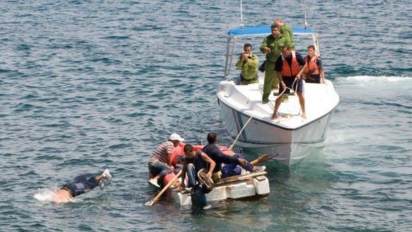 Would-be Cuban migrants are ordered by Cuban coast guards to return to the island. June 4, 2009.