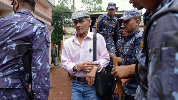 File pic of French serial killer Charles Sobhraj (C) at district court hearing
