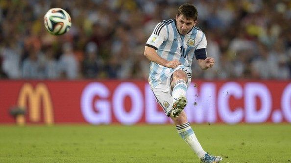 Lionel Messi in action for Argentina at the 2014 World Cup in front of a McDonald's advert