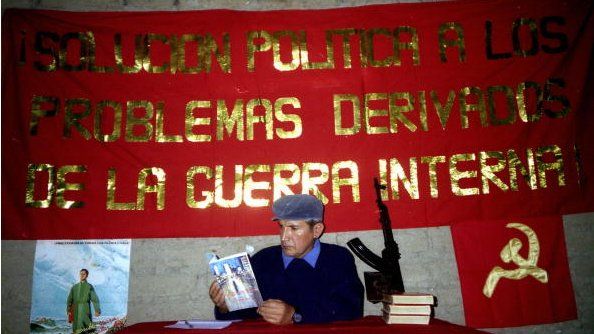 An undated file picture of Gabriel Uribe of the Shining Path showing his last novel 'What is coming' (Lo que se viene).