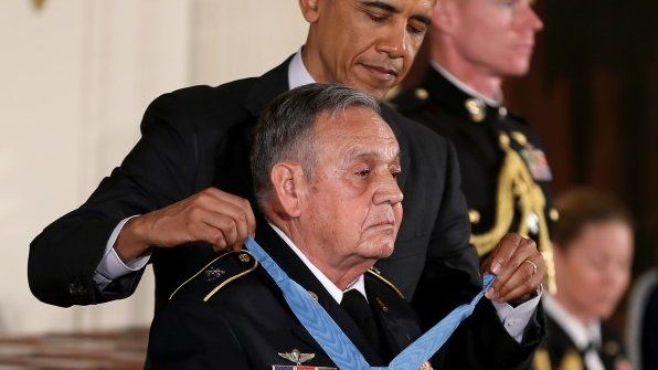 President Barack Obama presents the Medal of Honor on to US Army Sgt First Class Jose Rodela at the White House in Washington DC on 18 March 2014