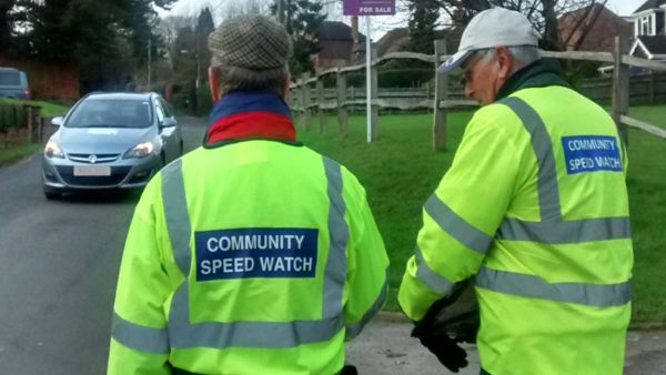 Two community speed watch members