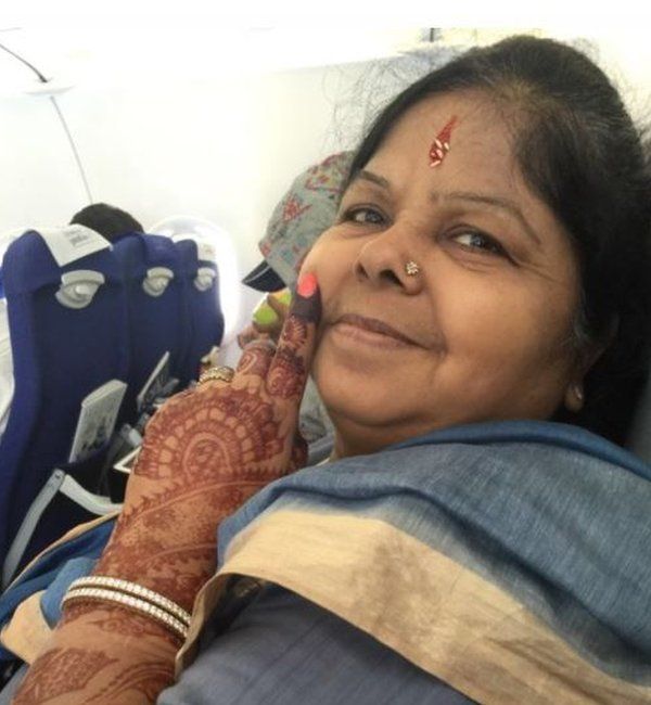 Shanti Bihani smiling on a plane