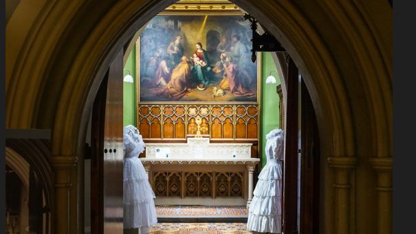 Two dresses at the entrance to the chapel