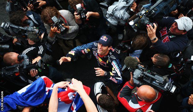 Mark Webber celebrates winning the 2009 German Grand Prix