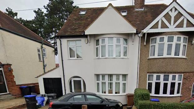 White rendered two-storey semi-detached property