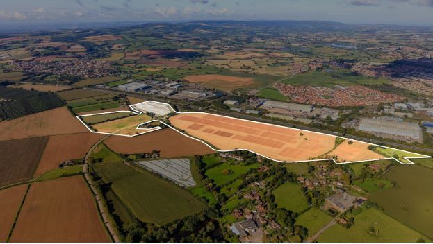 An aerial photograph of Notaro Park, a new 93-acre industrial development near Bridgwater, Somerset. The area is highlighted and around it there are fields and houses.