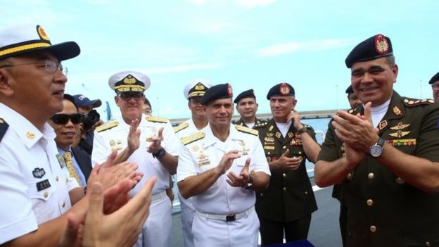Venezuela's Defence Minister Vladimir Padrino Lopez (R) attends the arrival ceremony of the China's People's Liberation Army (PLA) Navy hospital ship Peace Ark at the port in La Guaira, Venezuela September 22, 2018.