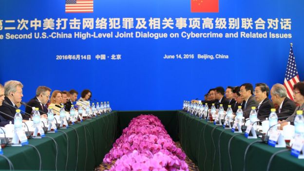 China's Minister of Public Security Guo Shengkun (3rd R) and US Ambassador to China Max Baucus (2nd L) attend the second US-China High-Level Joint Dialogue on Cybercrime and Related Issues at the Diaoyutai State Guesthouse in Beijing on June 14, 2016.