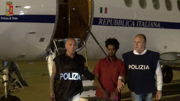 A police photo shows a people smuggling suspect arriving on Italian soil (8 June)
